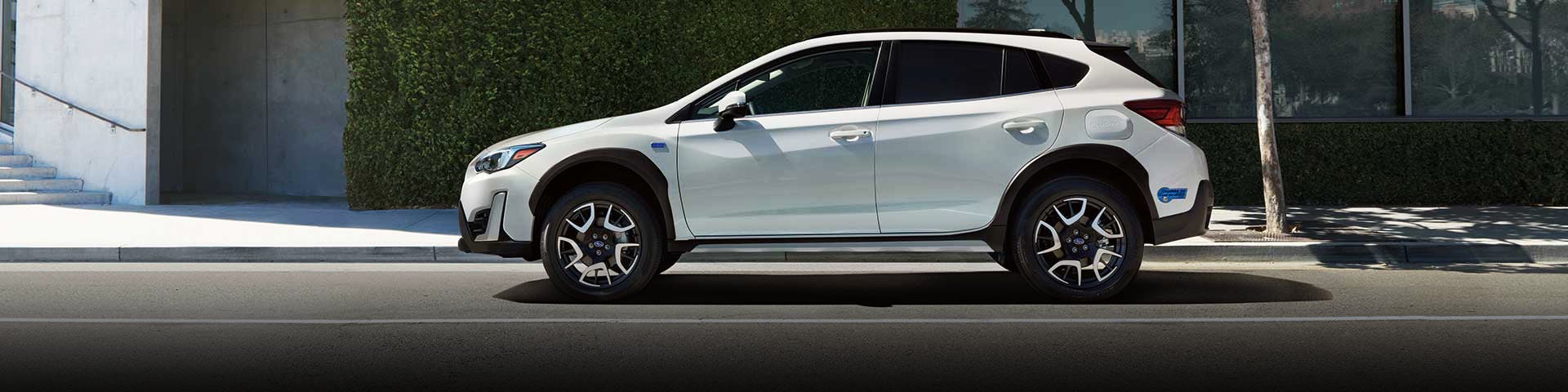 The side profile of a white Subaru Crosstrek Hybrid | Royal Moore Subaru in Hillsboro OR