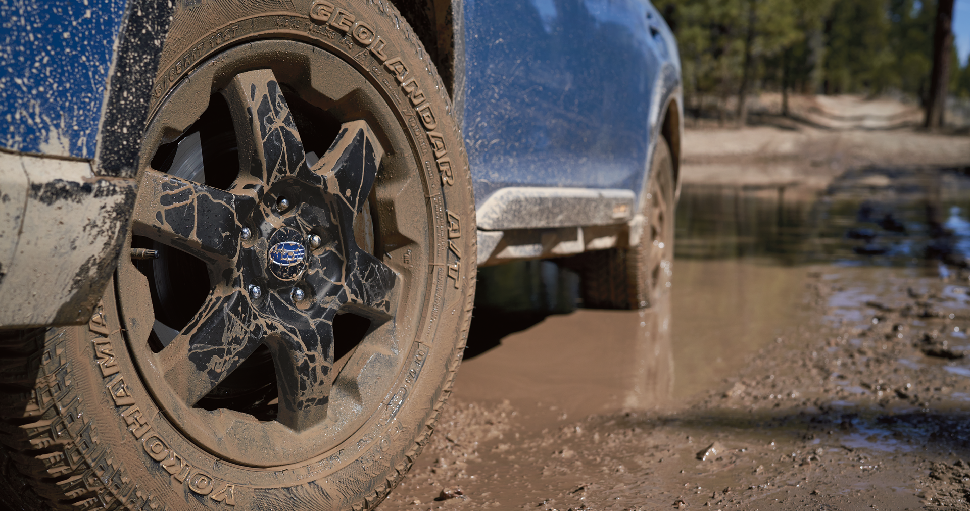A close-up of the 17-inch off-road wheels and all-terrain Yokohama GEOLANDAR® tires on the 2023 Outback Wilderness. | Royal Moore Subaru in Hillsboro OR