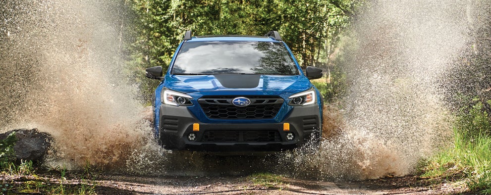A 2023 Outback Wilderness driving on a muddy trail. | Royal Moore Subaru in Hillsboro OR