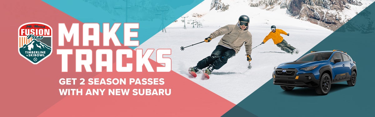 2025 Forester parked in front of someone skiing down a mountain